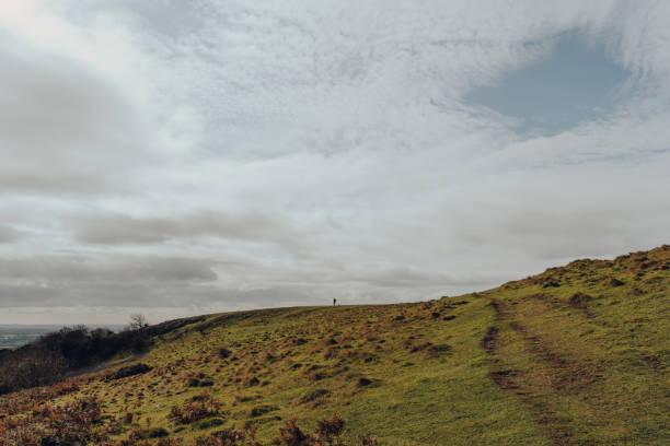 istock Green path going up the hill in Mendip Hills, Somerset, UK. 1283960620