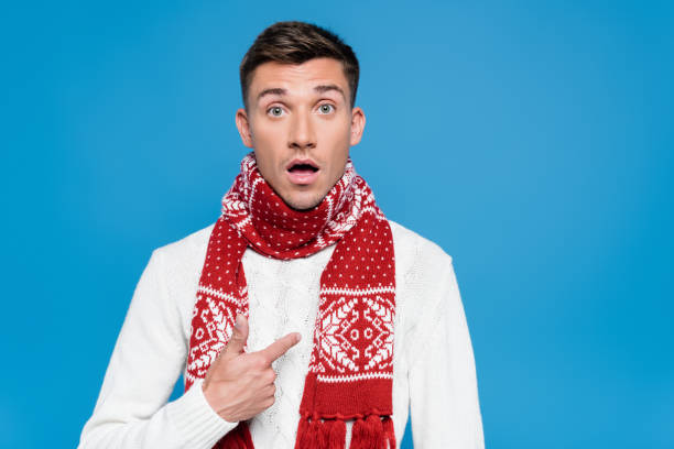 istock Shocked man with open mouth, pointing with finger at himself isolated on blue 1283960658