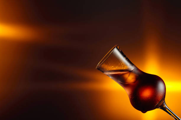 Steamed glass with strong alcoholic drink. Copy space.