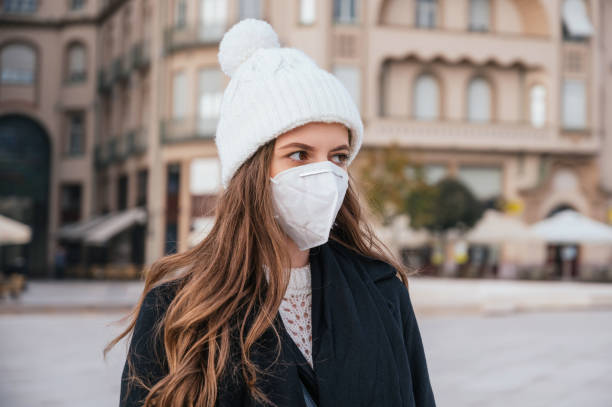 istock Beautiful young woman wearing mask 1283962542