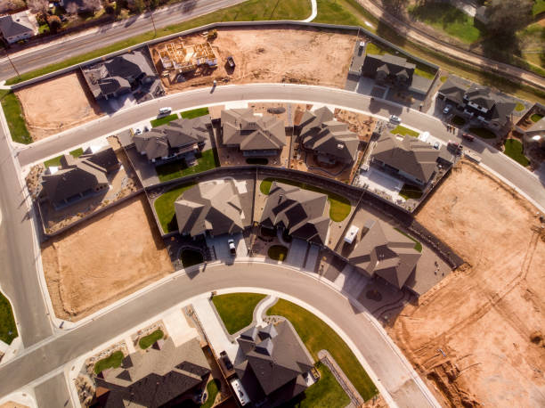 An Aerial Drone View Of A New Subdivision With New Construction And Homes Already Completed And Sold Drone view of a subdivision with already completed homes with families living in them, new construction, and lots prepared for construction fruita colorado stock pictures, royalty-free photos & images