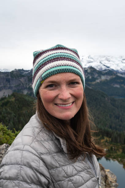 istock Woman in Winter Hat Looks at Camera 1283965171