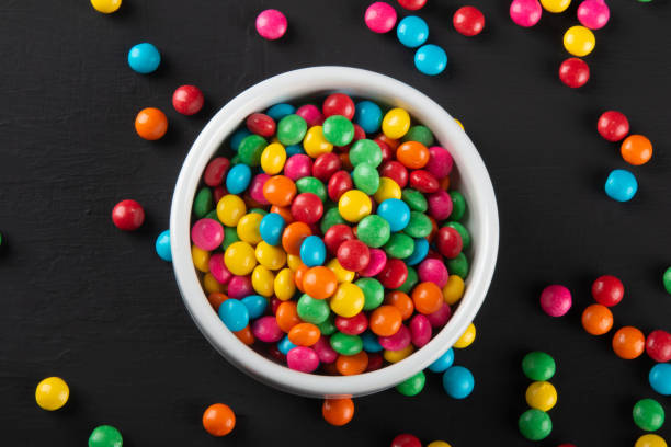 istock Colorful candy. Colorful sweets background. Black background. 1283965340