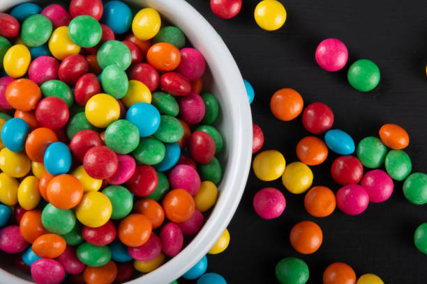 istock Colorful candy. Colorful sweets background. Black background. 1283965354