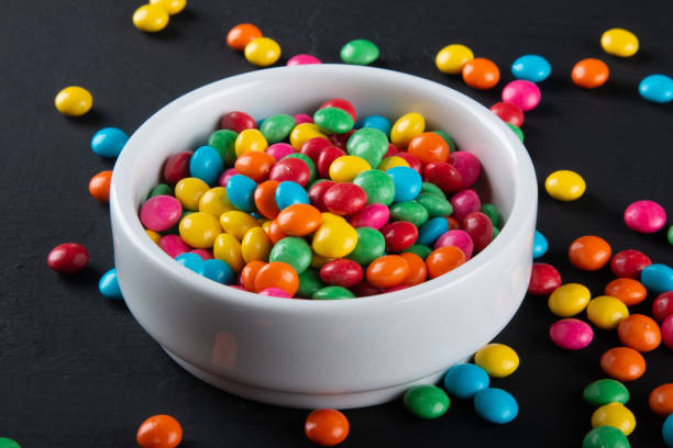 istock Colorful candy. Colorful sweets background. Black background. 1283965368