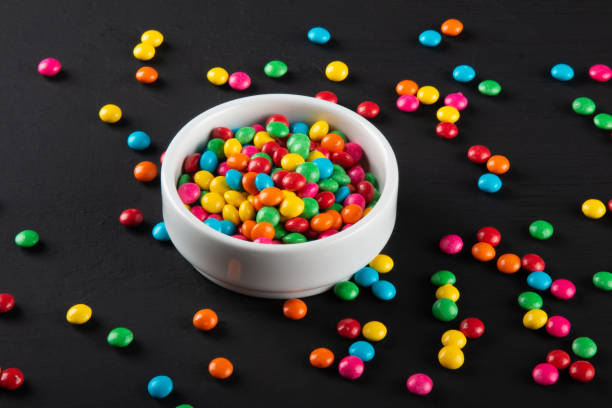 istock Colorful candy. Colorful sweets background. Black background. 1283965381