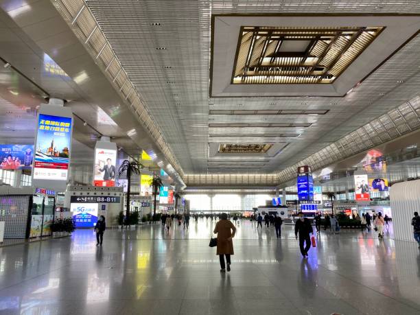 nanjing south railway station, china - editorial iphone train city stock-fotos und bilder