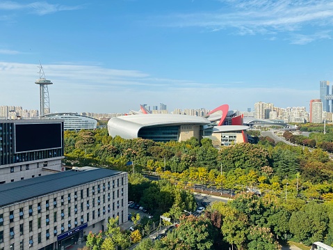 Nanjing, Jiangsu, China-November 3, 2020: Nanjing Olympic Sports Center lies in the southwest of the central area of Hexi new urban district. It covers a floor area of 89.6 hectares and a total building area of 401 thousand square meters. The Center mainly consists of main stadium, warming-up site, gymnasium, natatorium, press center, tennis center, baseball field, softball field, sports park and auxiliary projects. Here is the exterior veiw of the Center.