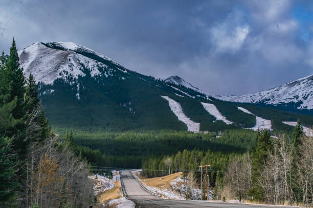 istock Single Lane Highway Going through the Rocky Mountains 1283968955