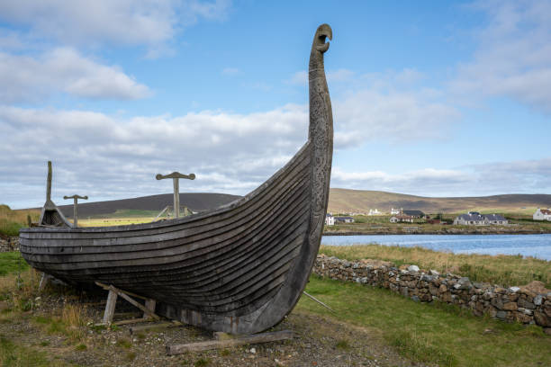 Viking boat replica A replica of the Viking boats at Haroldswick on Unst Island in the Shetland Islands. viking ship photos stock pictures, royalty-free photos & images