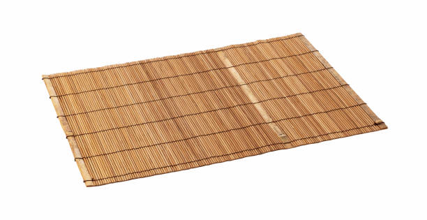 istock A wooden luncheon mat on a white background. View from an angle 1283973639