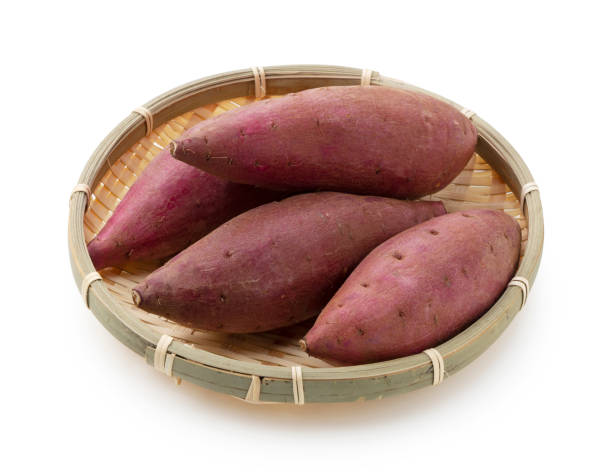 istock Sweet potatoes in a colander on a white background 1283973684