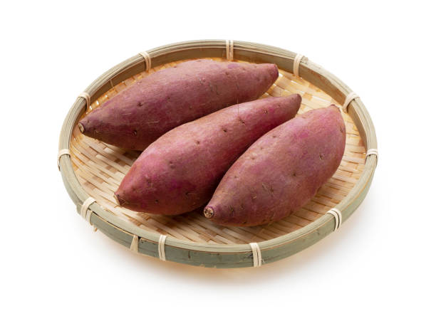 istock Sweet potatoes in a colander on a white background 1283973791