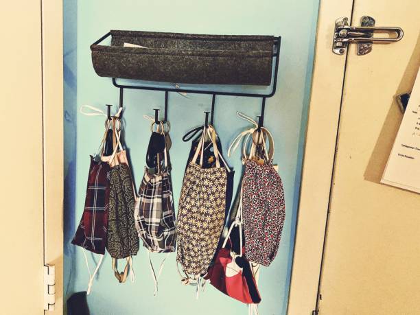 istock COVID Masks Hanging by the Front Door 1283977814