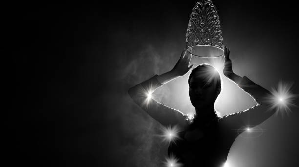 Silhouette Miss Beauty Queen Pageant Contest and win Diamond Crown Silhouette abstract of woman body presents as Miss Beauty Queen Pageant Contest and win Diamond Crown. Backlit smoke low exposure dark background copy space beauty queen stock pictures, royalty-free photos & images
