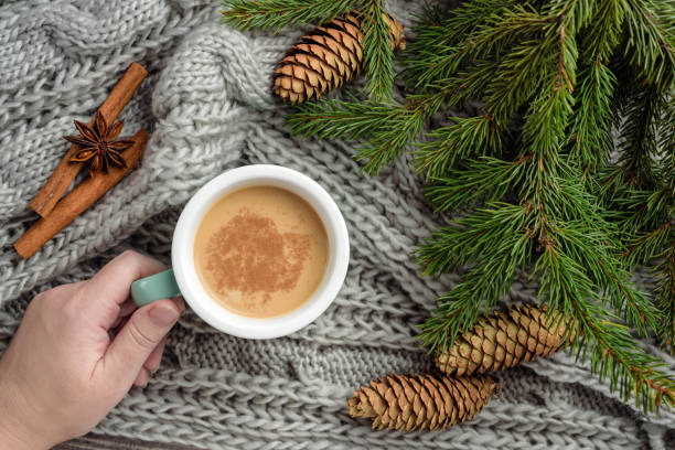 istock composition with fir branches, a blanket and a mug with cocoa. 1283983054