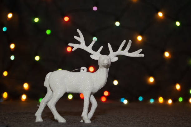 istock christmas decoration deer toy on garland background 1283985757