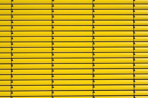 Background from yellow metal blinds