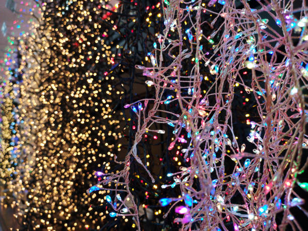 istock Christmas lights over dark background 1283987938