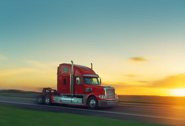 istock Red tractor truck speeding at sunset in Miami 1283988771