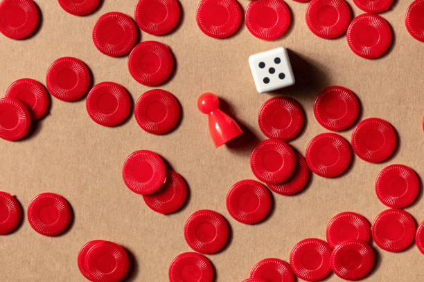istock Board games concept, red pieces, shot from the top with a die 1283989470