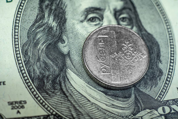 istock Belarusian ruble on the background of 100 dollars close-up 1283991383