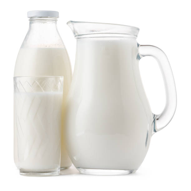 istock Glassware full of fresh milk isolated on white 1283991543