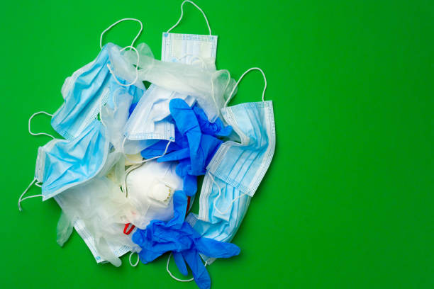 istock Protective equipment, masks and gloves, on green background 1283991559