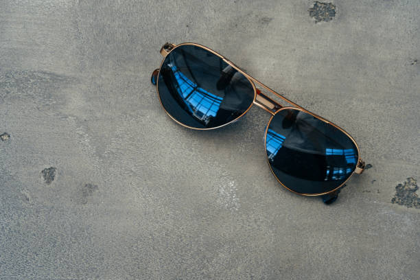 istock New dark aviator glasses on grey concrete background 1283991614