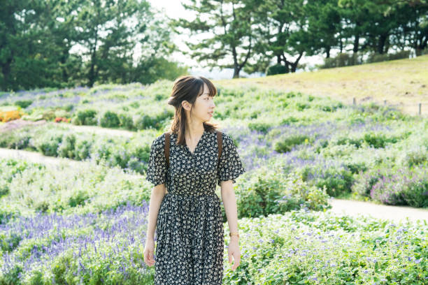 istock Asian young woman taking a walk 1283991676