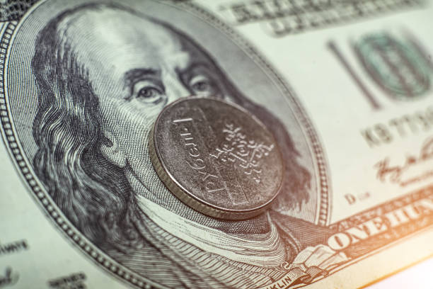 istock Belarusian ruble on the background of 100 dollars close-up 1283992223