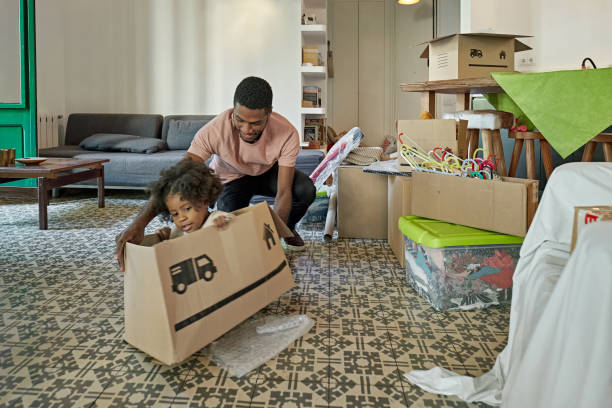 istock Afro-Caribbean Father Playing with Toddler on Moving Day 1283992340