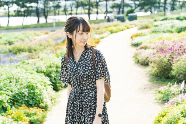 istock Asian young woman taking a walk 1283992590