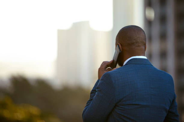 istock Confident man talking on the phone with scenic view 1283993515