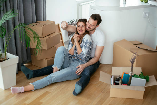 istock Happy couple is unpacking their belongings 1283993737