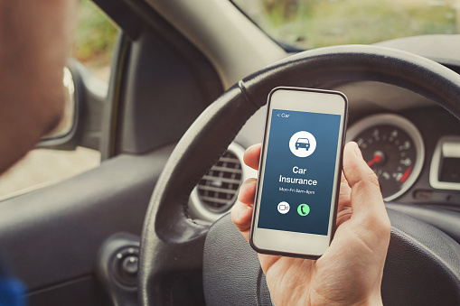 car insurance concept on phone screen, call road assistance