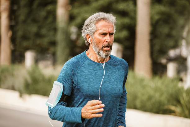 istock Active senior man jogging on a sunny day 1283996091