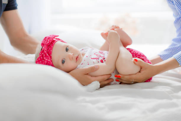 istock a little child is lying on the bed 1283996947