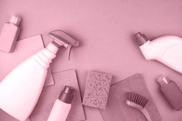 House cleaning products are on pinkl background.