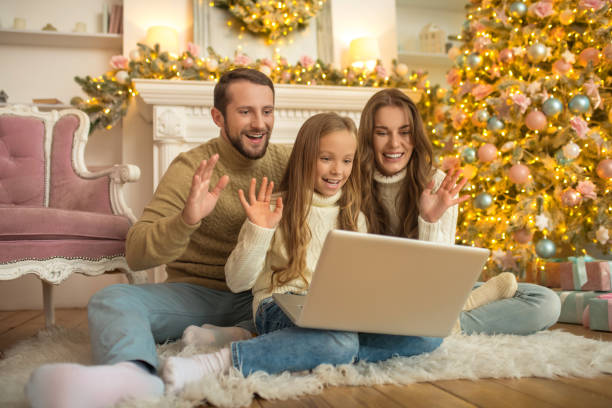 istock Young parents and their daughter having a video call 1283997747