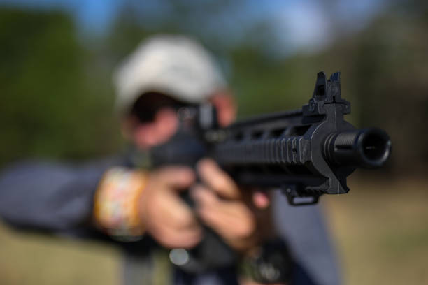 istock A game ranger aiming thru a rifle 1283998987
