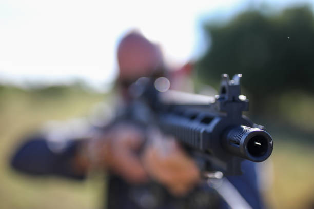 istock A game ranger aiming thru a rifle 1283999087