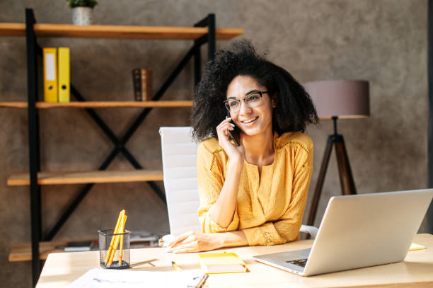 istock A young woman is using laptop at office 1284000160