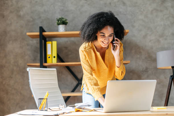 istock A young woman is using laptop at office 1284000163