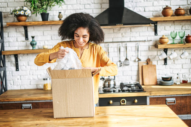 istock An african woman is unpacking cardboard box 1284000181