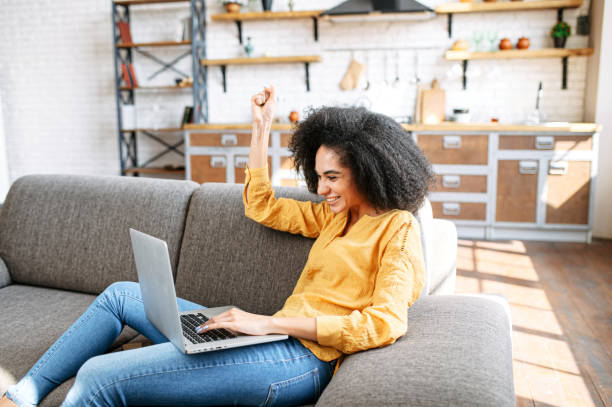 istock young woman is using laptop at home 1284000182