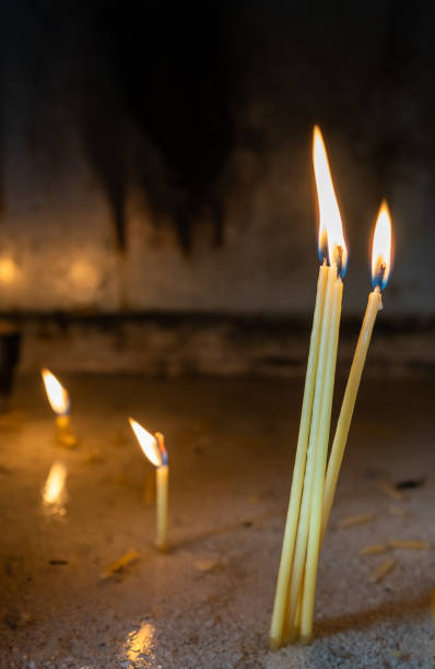 istock Row of burning memorial candles 1284000298