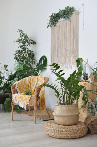 istock Wicker chair with a plaid in a cozy boho-style interior 1284001320