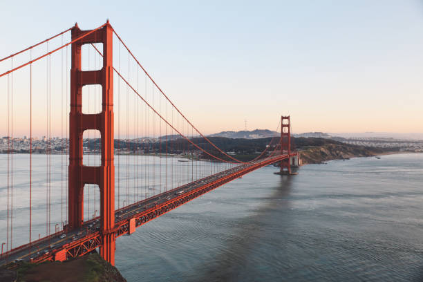 istock Suspension Bridge Over River Against Sky In Sunset 1284002315
