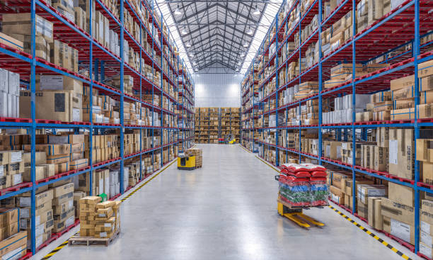 istock large warehouse full of goods and with lifting equipment. 1284002974